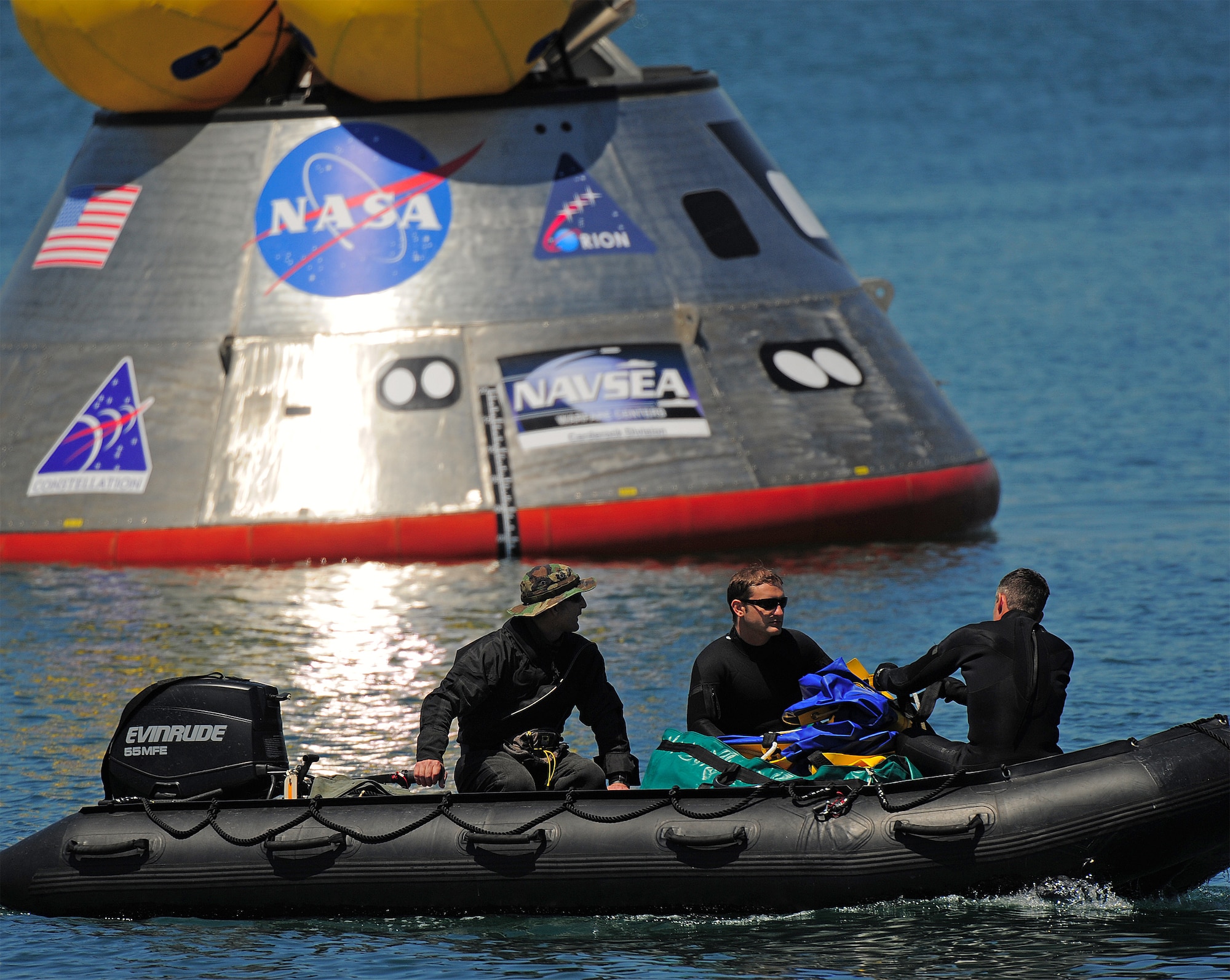 CAPE CANAVERAL AIR FORCE STATION, Fla. – Pararescuemen from the Air Force Reserve’s 920th Rescue Wing prepare to deploy an inflatable flotation collar during recovery testing on a mockup of the Orion crew exploration vehicle at the Trident Basin at Port Canaveral, Fla., Mar. 8. The collar is designed both to stabilize the capsule after water landing and provide a platform for recovery personnel to stand on during the operation. Orion is targeted to begin carrying humans to the International Space Station in 2015 and to the moon by 2020. Orion is part of the NASA’s Constellation Program. Reservists from the 920th provide contingency medical and recovery support for all NASA shuttle launches. The unit’s primary mission is combat search and rescue. (U.S. Air Force photo/Tech. Sgt. Paul Flipse)