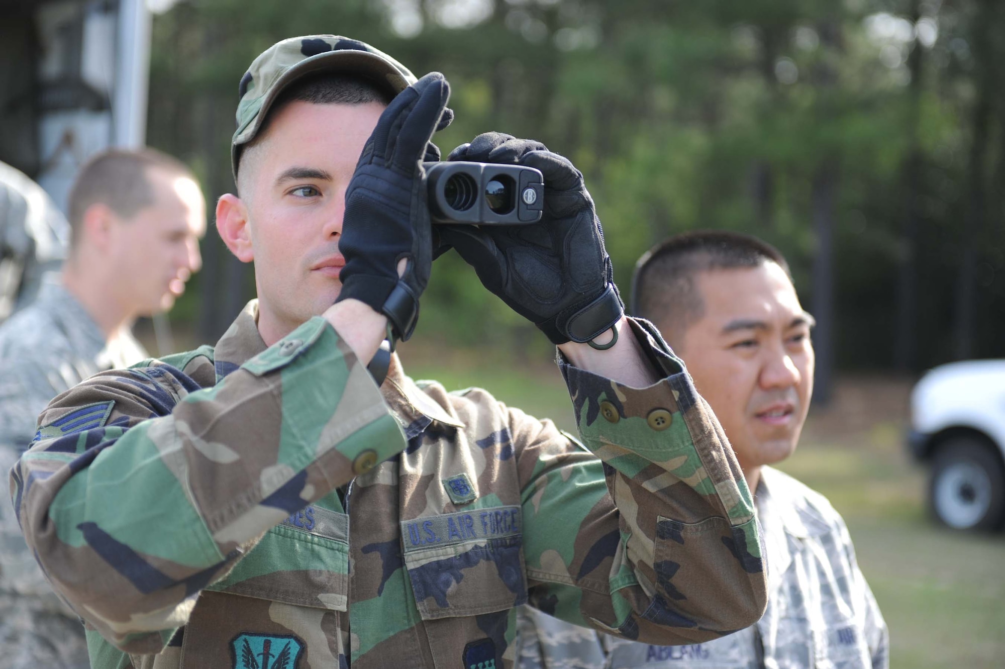 SHAW AIR FORCE BASE, S.C. -- Senior Airman Earl Barnes, 20th Aermedical-Dental Squadron bioenviromental engineering technician, uses a rangefinder to set up an intial cordon during a hazardous materails exercise April 9, 2009. The HAZMAT exercises help prepare Airman in 20th ADOS and 20th Civil Engineer Squadron to properly respond to real world operations. (U.S. Air Force photo/Senior Airman Matt Davis)