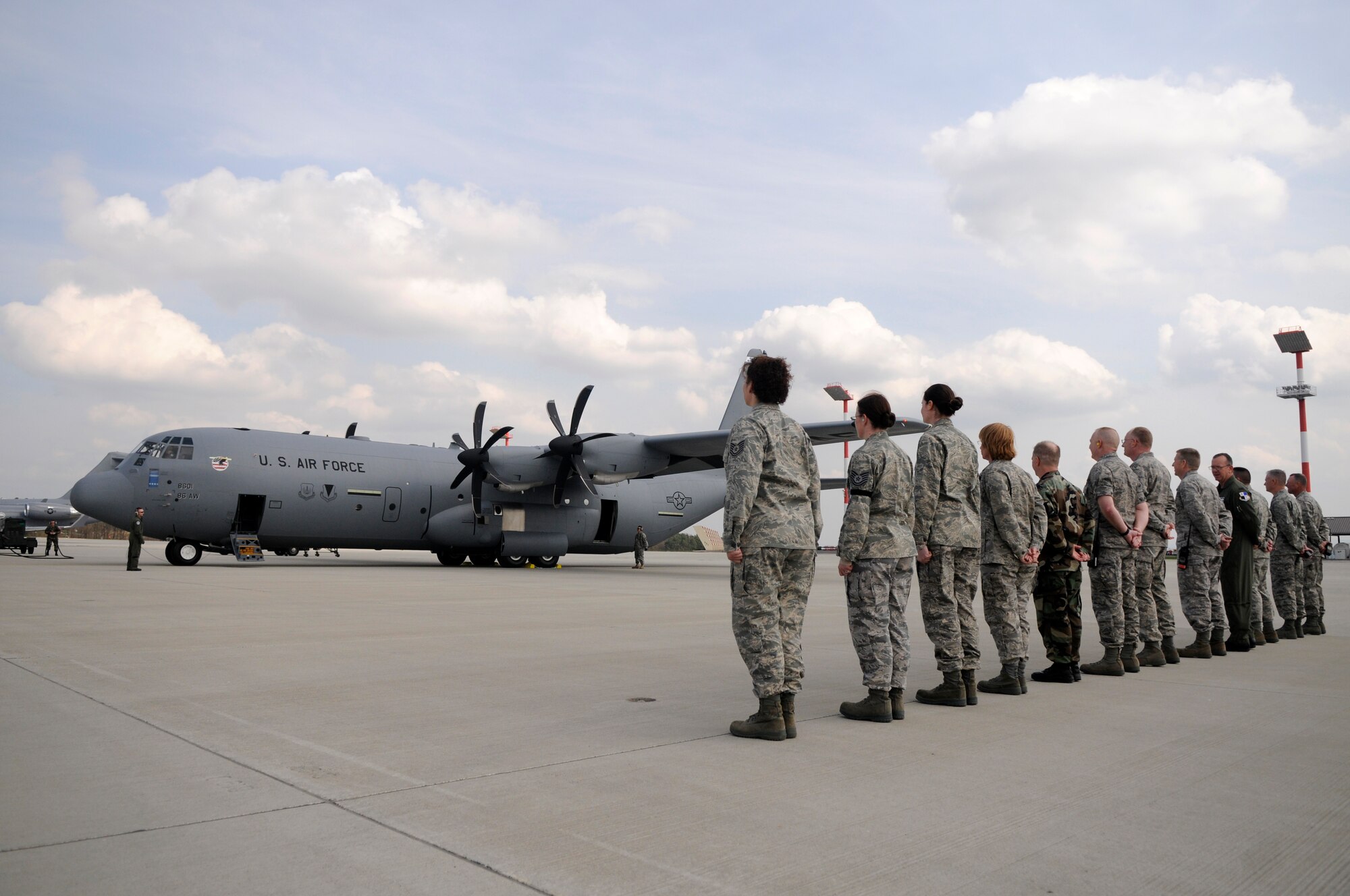 SPANGDAHLEM AIR BASE, Germany – Members of the 52nd Fighter Wing wait to send off Gen. Roger A. Brady, U.S. Air Forces in Europe commander. The general flew the C-130J Super Hercules aircraft to Ramstein Air Base April 7, 2009. (U.S. Air Force photo by Airman 1st Class Staci Miller)