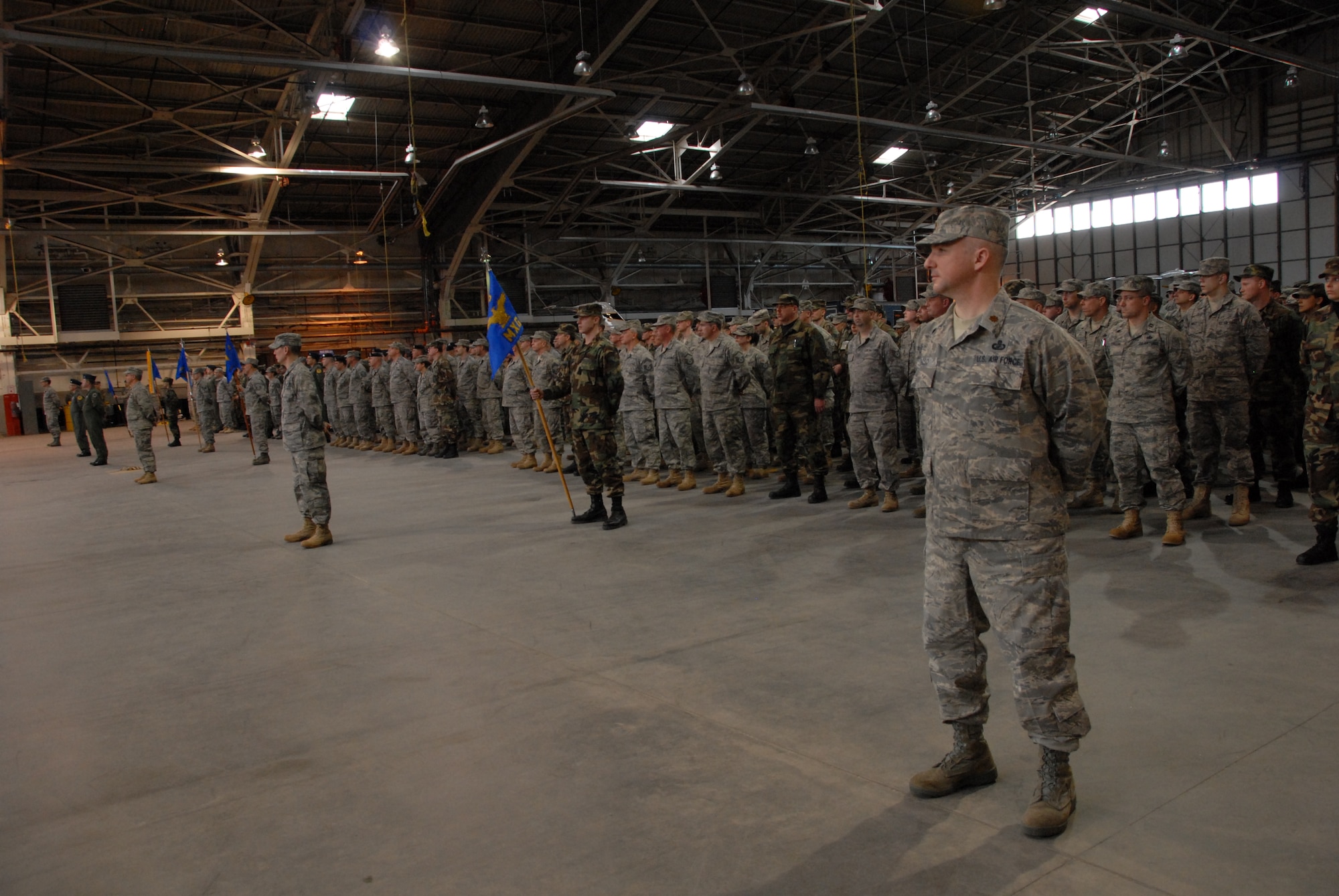 Members of the 103rd Airlift Wing stand in formation during a change of command ceremony Mar. 8, 2009.   During the ceremony, command of the wing was transferred from Col. Brian P. Barnes to Col. Frank N. Detorie.  (U.S. Air Force Photo by Staff Sgt. Erin McNamara)