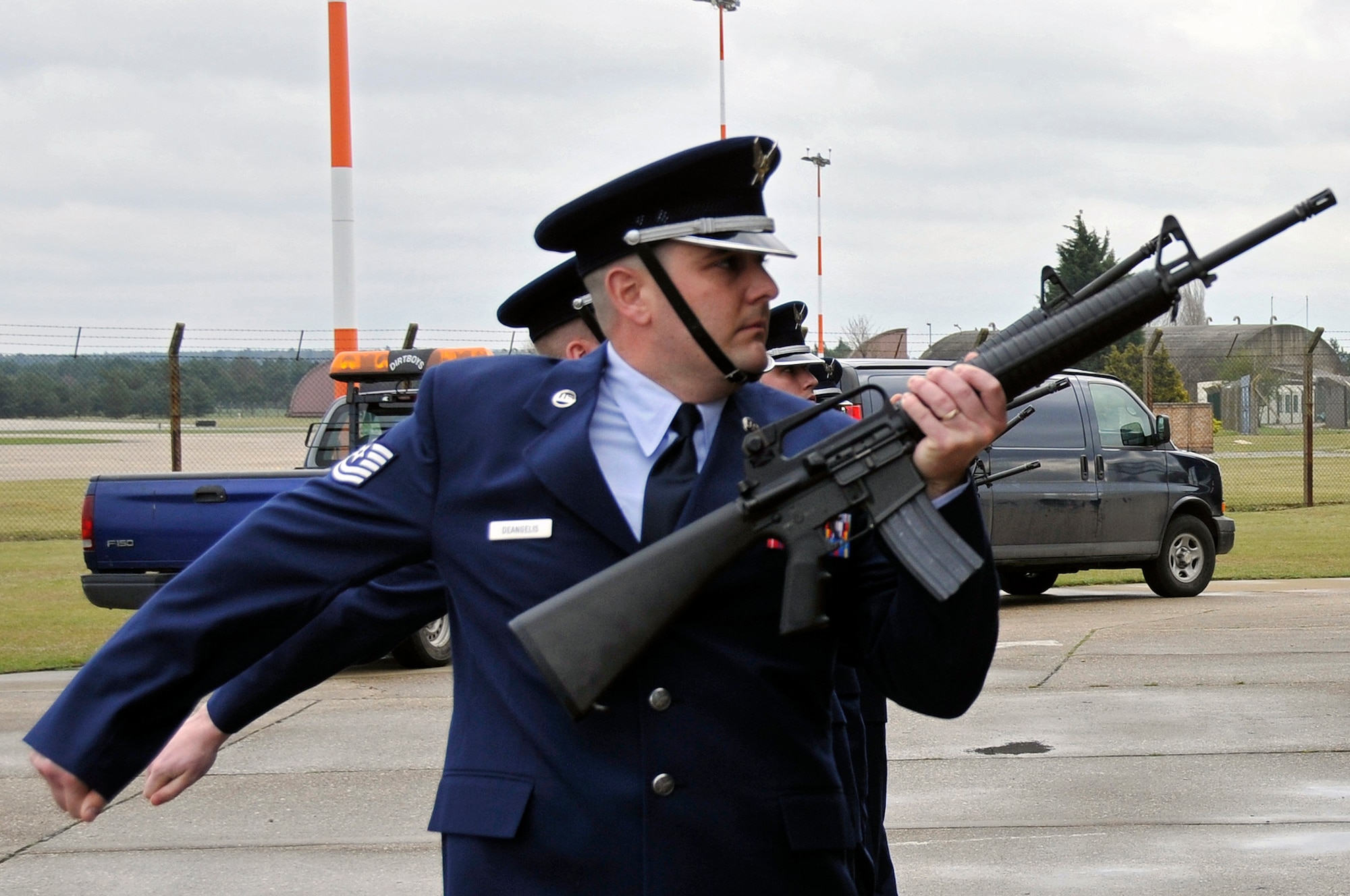 ROYAL AIR FORCE LAKENHEATH, England -- 48th Civil Engineer Squadron Airmen perform a three volley salute here for Tech. Sgt Phillip A. Myers's memorial ceremony April 9, 2009. Sergeant Myers was killed in action April 4 near Helmand Province, Afghanistan, from wounds suffered from an improvised explosive device. (U.S. Air Force photo by Airman 1st Class Perry Aston) (Released)