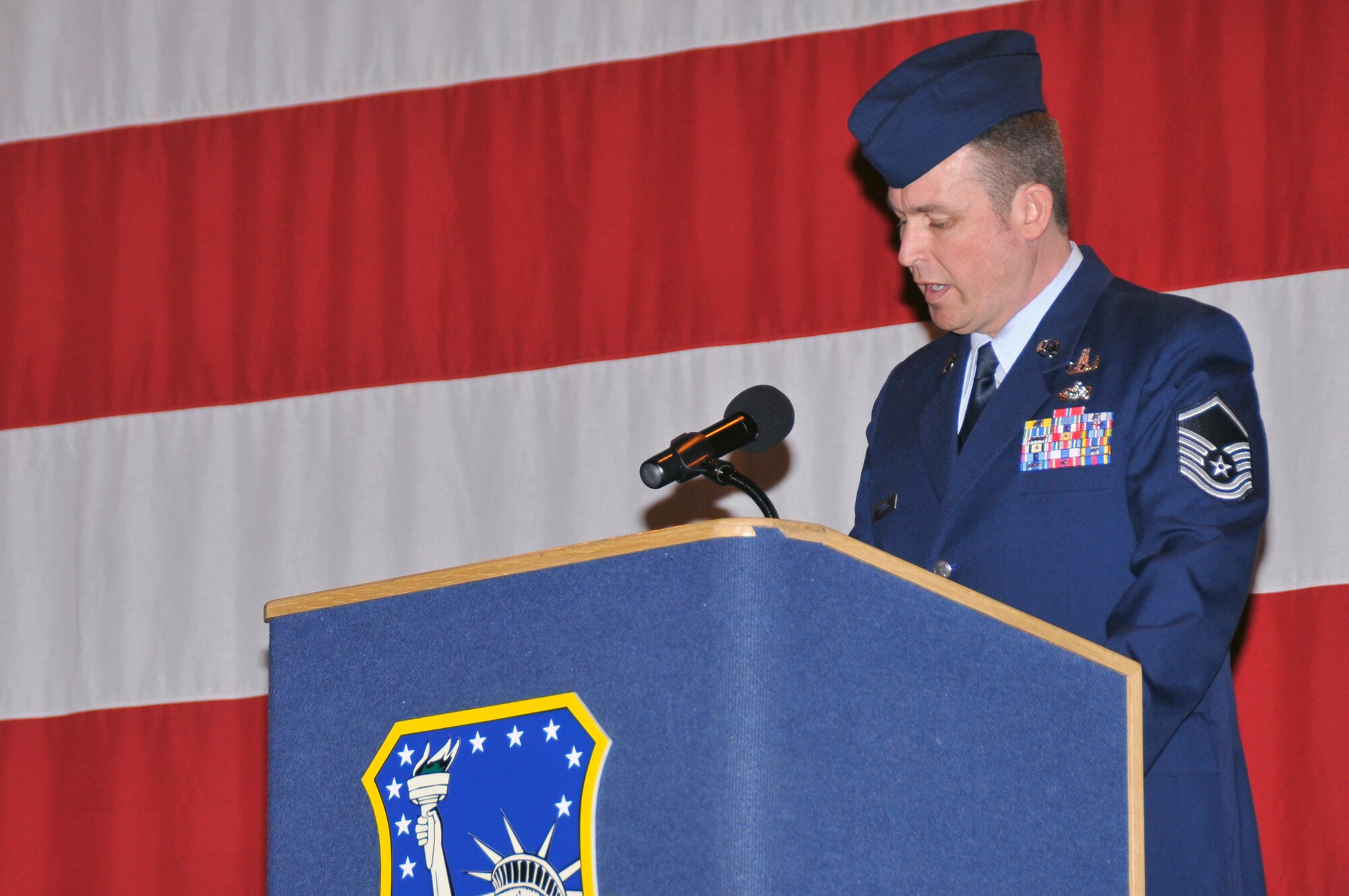 ROYAL AIR FORCE LAKENHEATH, England -- Master Sgt. Kieran Flynn, 48th Civil Engineer Squadron explosive ordinance disposal flight, performs roll call here April 9, 2009. During Tech. Sgt Phillip A. Myers's memorial ceremony (U.S. Air Force photo by Airman 1st Class Perry Aston) (Released)