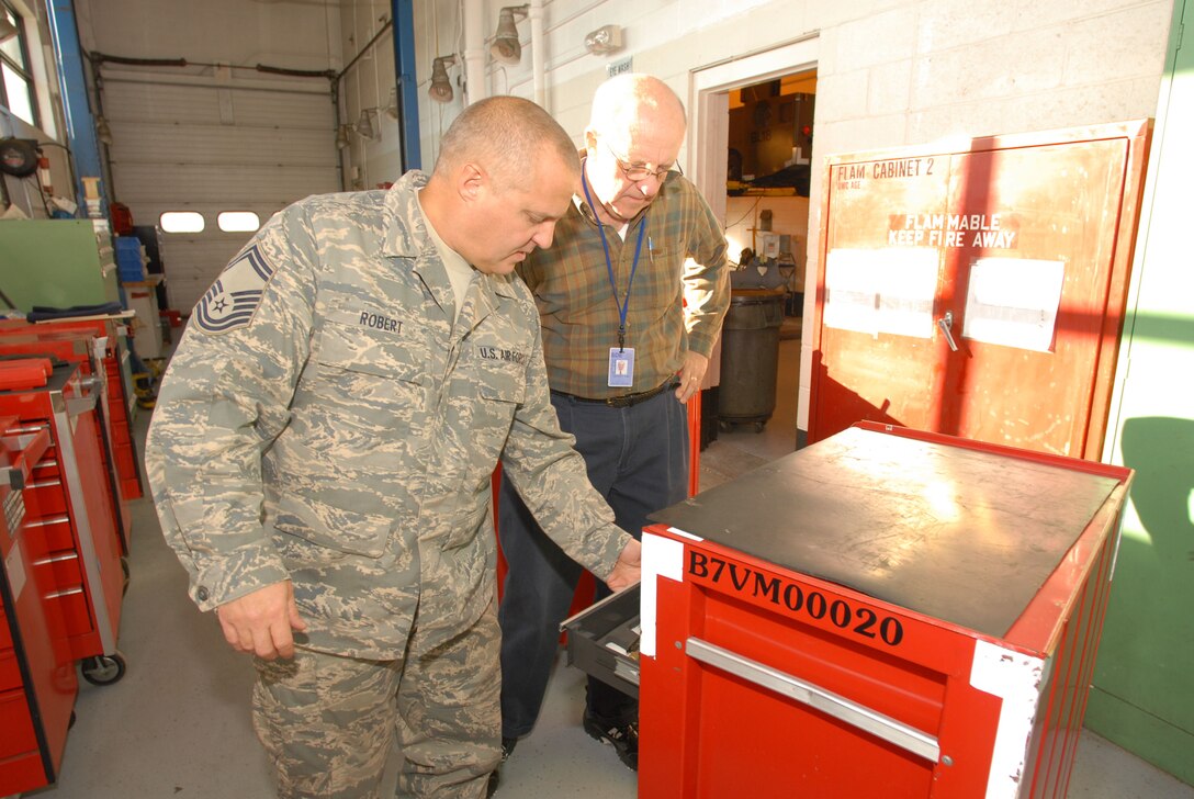 Senior Master Sgt. Shawn Roberts, superintendent, 103rd Aerospace Ground Equipment, shows tools slotted for donation to Laurence Eiden, consultant to Connecticut State Department of Education Nov. 18, 2008. The two men worked hand-in-hand throughout the day at Bradley Air National Guard Base choosing what tools to provide to various area schools.   (U.S. Air Force photo by Staff Sgt. Erin McNamara) 
