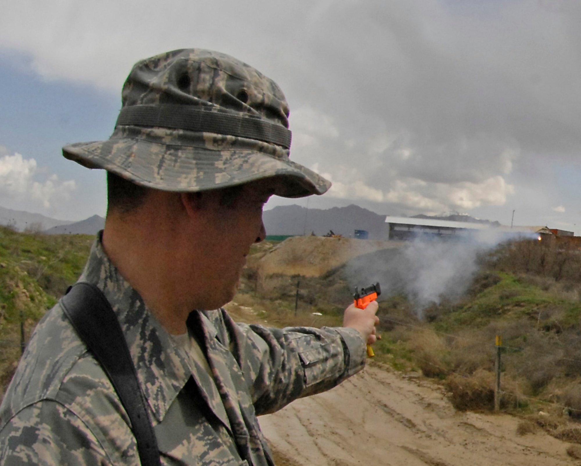 Tech. Sgt. Shane Sweeney, 455th Air Expeditionary Wing weapons safety, fires off pyrotechnics that helps scare off birds near the flightline March 29. The seven-member team of safety experts here patrol hot spots around the airfield's flightline to minimize the threat of bird strikes on the various aircraft taking off and landing.