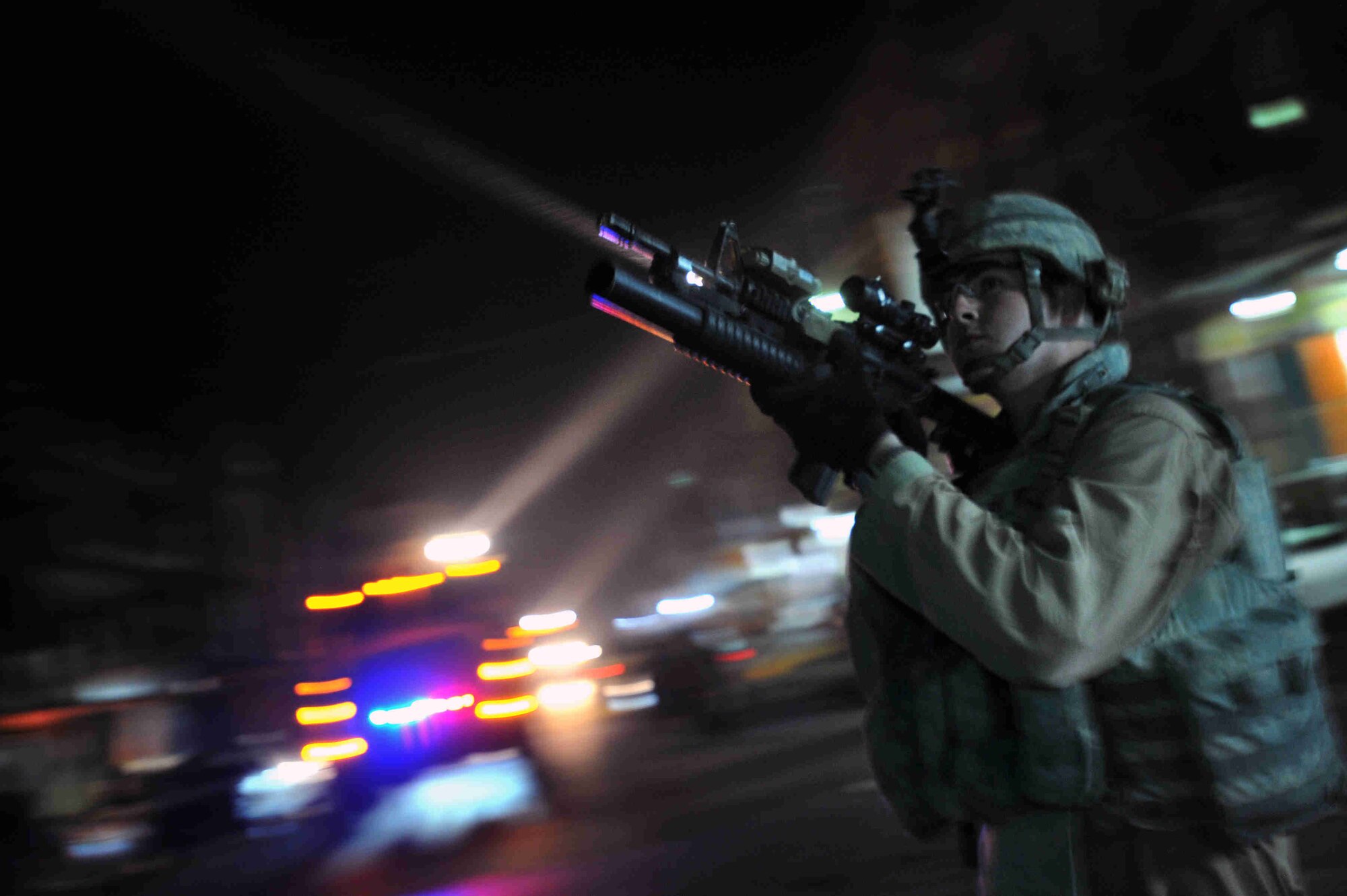 Staff Sgt. Jarrett Cox of Lilburn Ga., scans his perimeter during a joint walking patrol with Iraqi National Policemen in the Sadiah district of southern Baghdad, Iraq, Dec. 17, 2008. (U.S. Navy Photo by Petty Officer 2nd Class Todd Frantom)