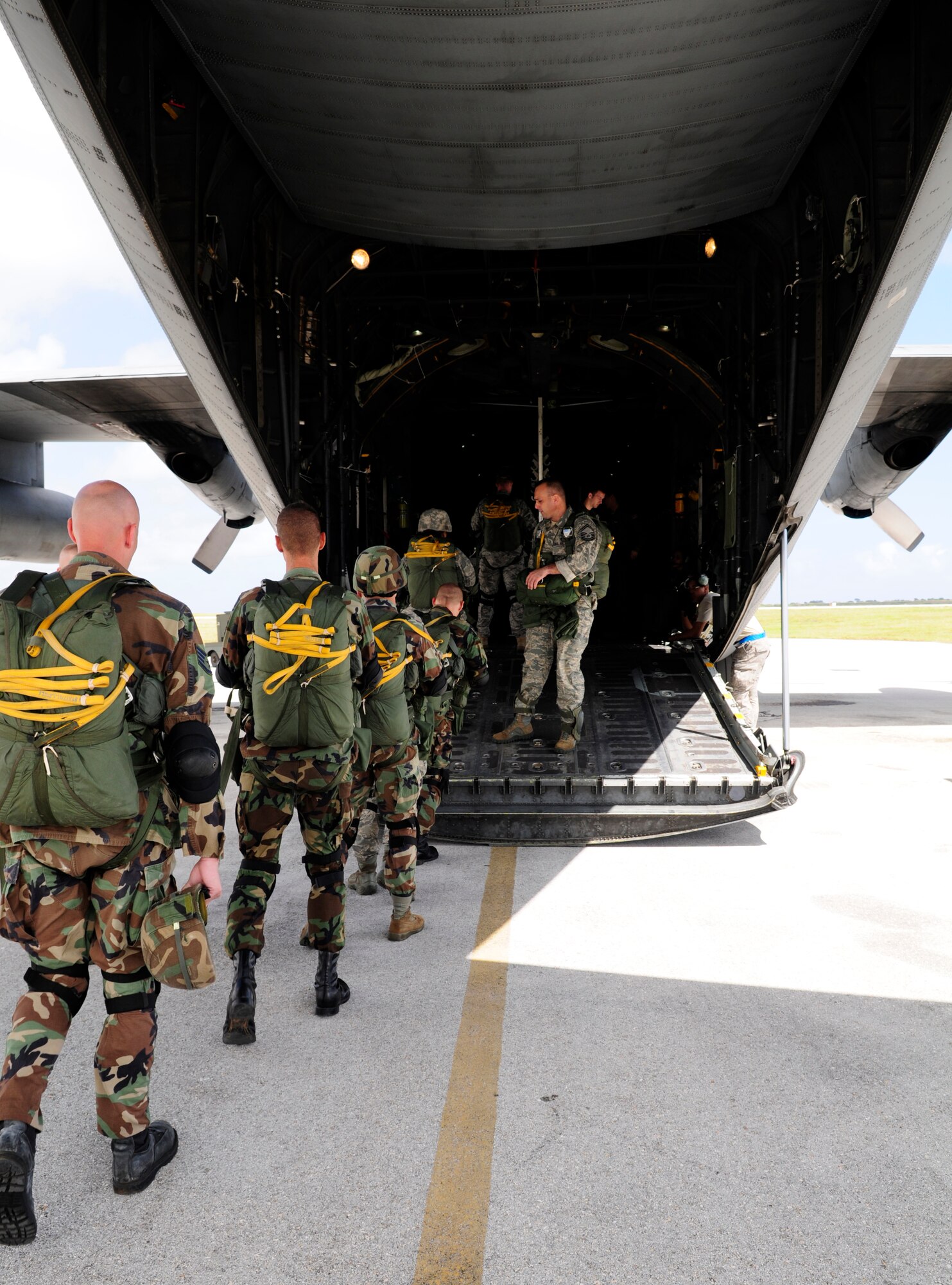 ANDERSEN AIR FORCE BASE, Guam - The eight members of the 36th Contingency Response Group board a C-130 Hercules single file here April 7.  Jump Master Senior Master Sgt. Paul Schaaf, Senior Parachutist gave words of encouragement as they loaded the plane. (U.S. Air Force photo by Airman 1st Class Courtney Witt)