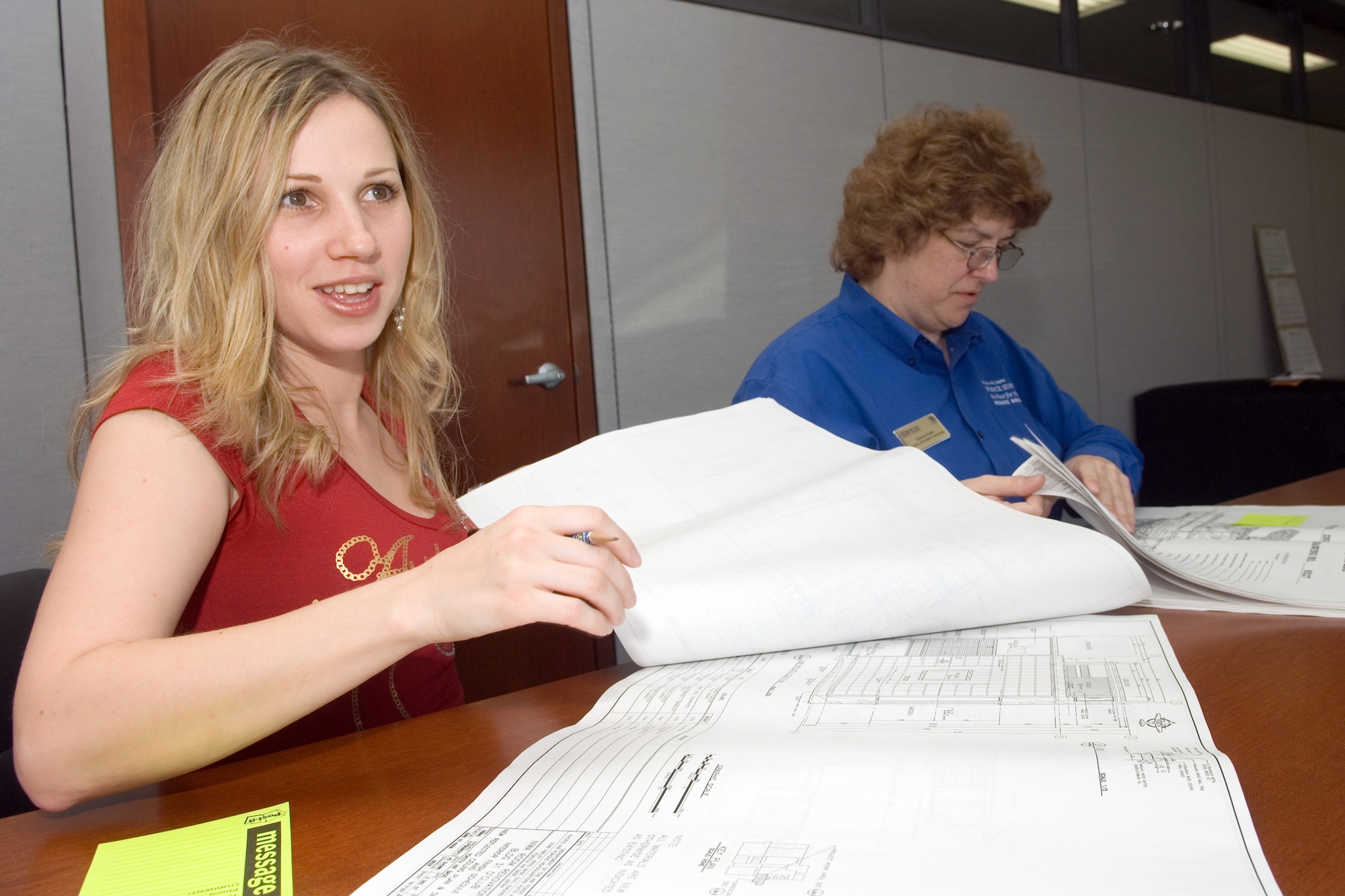 YOKOTA AIR BASE, Japan -- Svetlana Statina (left) and Debora Fuller (right), 374th Force Support Squadron Human Resource Flight, attend a meeting for the new Yokota Air Base Service's Facilities here, April 9. The Human Resource Flight is part of the 374th FSS which received the Air Force General Curtis E. LeMay Award recognizing the best FSS for 2008. The LeMay is an annual award for the best FSS throughout the Air Force.  (U.S. Air Force photo/Osakabe Yasuo)
