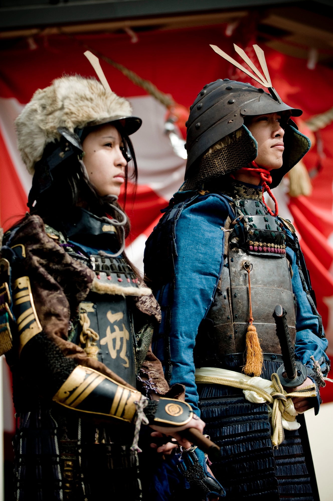 MISAWA AIR BASE, Japan -- Kathy
Dela Cruz and Mark Garces stand silently dressed as samurai during the Japan Day opening ceremony April 4, 2009. One of the exhibits that day gave Americans the chance to try on armor such as this. (U.S. Air Force photo by Staff Sgt. Samuel Morse)