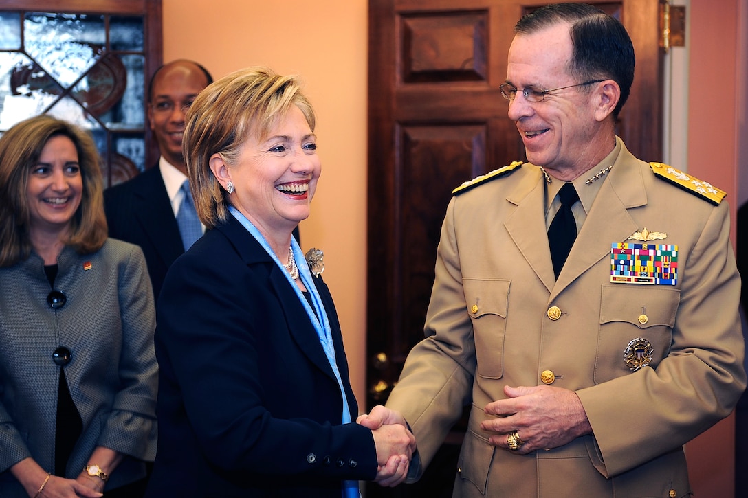 U.S. Secretary of State Hillary Clinton welcomes U.S. Navy Adm. Mike Mullen, chairman of the Joint Chiefs of Staff, to the U.S. State Department during the Australian Ministerial, April 9, 2009.