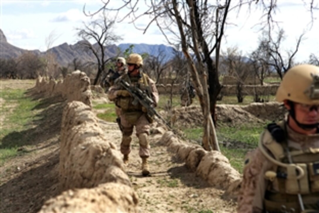 U.S. Marines patrol the abandoned village of Now Zad in Helmand province, Afghanistan, April 6, 2009. The Marines are assigned to the Explosive Ordnance Disposal, 9th Engineer Support Battalion, which is attached to Lima Company, 3rd Battalion, 8th Marine Regiment. 