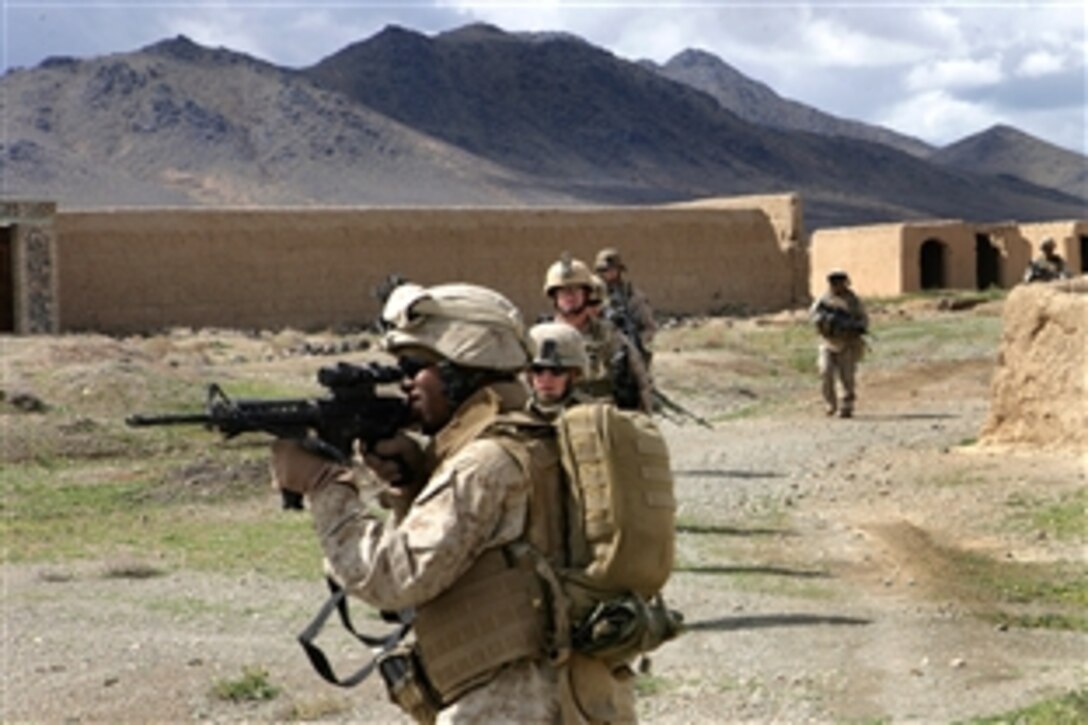 U.S. Navy Seaman Lucas J. Jettson looks through his weapon's scope for possible insurgent activity during a security patrol in the abandoned village of Now Zad in Helmand province, Afghanistan, April 6, 2009. Jettson is a hospital corpsman assigned to Lima Company, 3rd Battalion, 8th Marine Regiment.