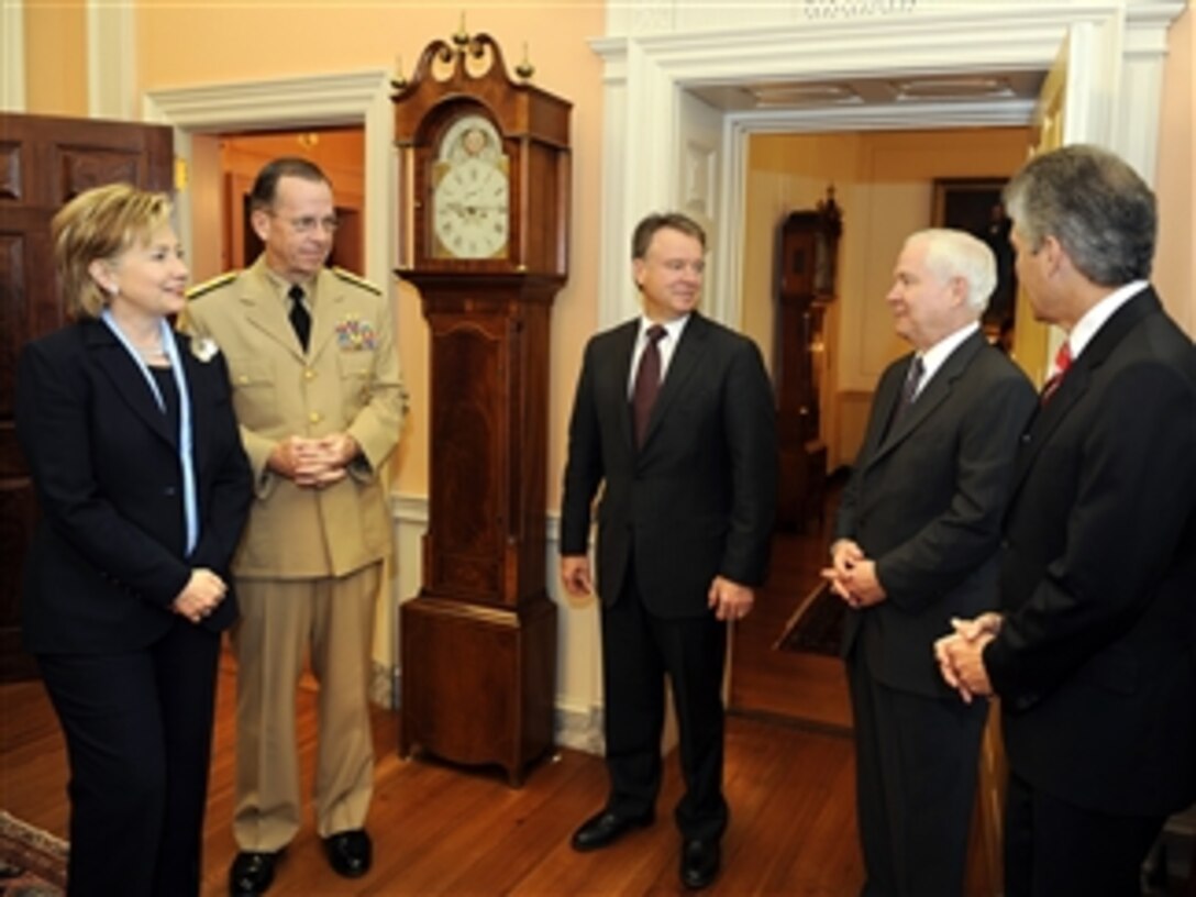 Secretary of State Hillary R. Clinton (left) talks with Chairman of the Joint Chiefs of Staff Adm. Mike Mullen (2nd from left), U.S. Navy, Australian Defense Minister Joel Fitzgibbon, Secretary of Defense Robert M. Gates (2nd from right) and Australian Minister for Foreign Affairs Stephen Smith at the State Department during the Australian Ministerial on Apr. 9, 2009.  
