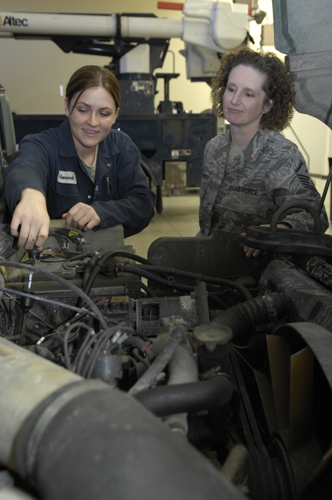 VANDENBERG AIR FORCE BASE, Calif. -- 1st Sgt. Angela Fernandez from 30th Logistics Readiness Squadron, observes an Airman ensure vehicles are compliant with Air Force standards. A first sergeant spends time building a positive relationship with Airmen in order to help keep Airmen focused on the mission. (U.S. Air Force photo/Airman 1st Class Andrew Lee)