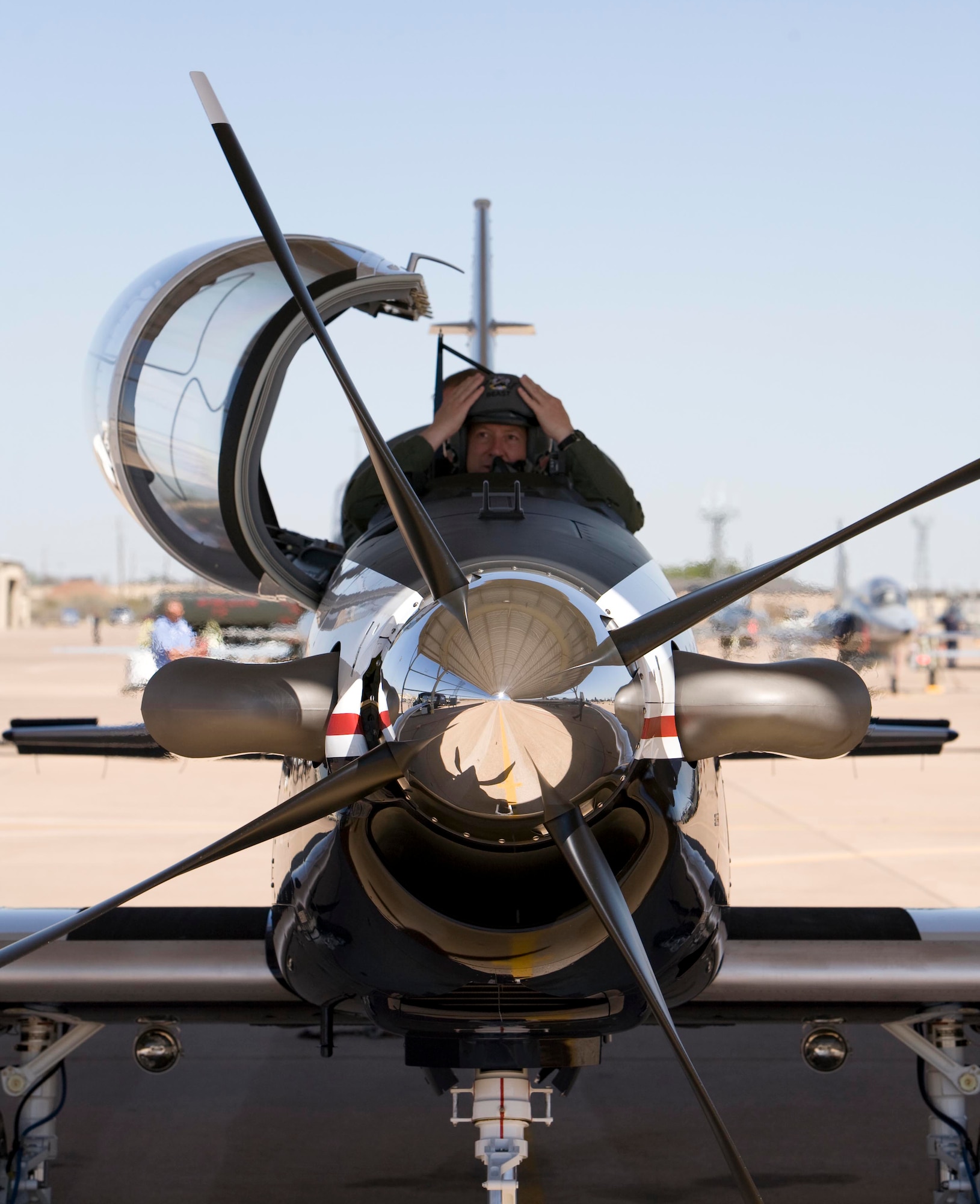 Maj. Gen. Gregory Feest, 19th Air Force commander, prepares to egress a brand new T-6 Texan II April 7 at the 80th Flying Training Wing. The general and Col. David Petersen, 80th FTW commander, picked up the new trainer that morning at Hawker-Beechcraft in Wichita, Kans. (U.S. Air Force photo/Lt. Col. Ternell Washington)