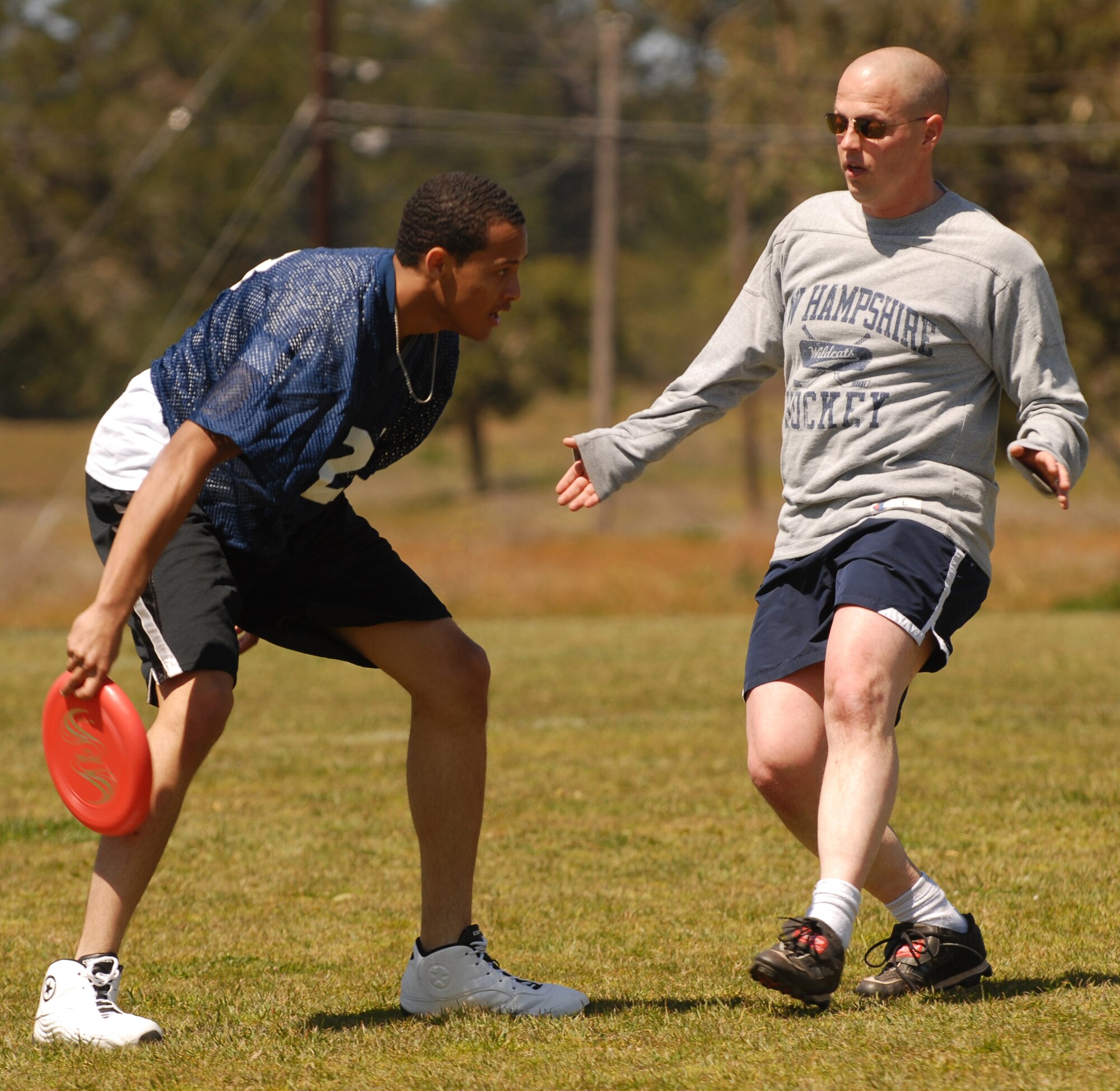 VANDENBERG AIR FORCE BASE, Calif. -- Lt. Col. Michael Dombrowski, the 30th Space Communications Squadron commander, defends Airman Randolph Patterson, also with 30th SCS, during an ultimate Frisbee match April 3 at the base track. Sports days are one of the many events used to build moral within squadrons. (U.S. Air Force photo/Airman 1st Class Antoinette Lyons)