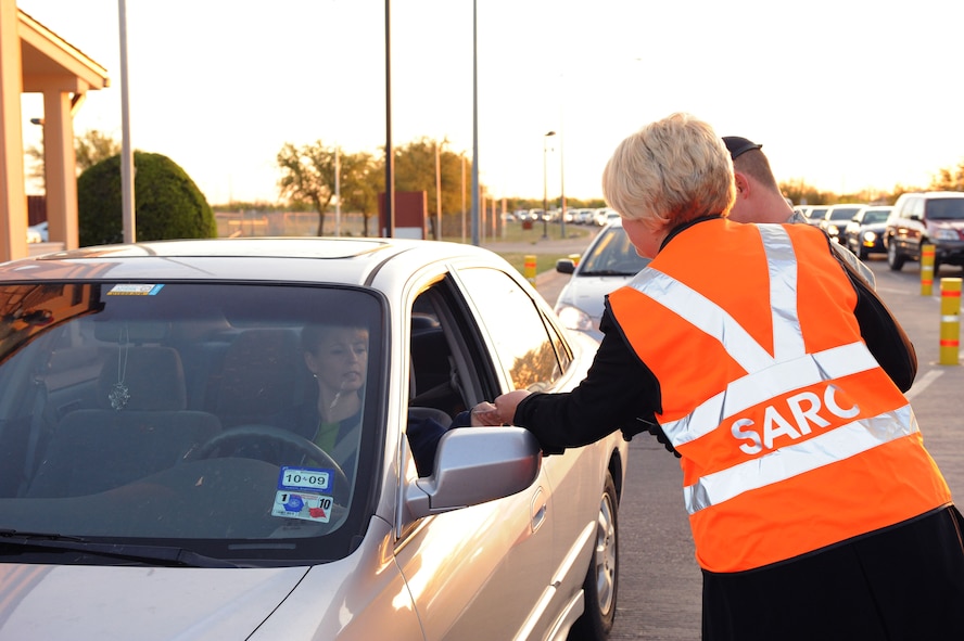 DYESS AIR FORCE BASE, Texas - Sexual Assault Rescue Coordinator (SARC) Staci Vileta hands out information at the front gate here, April 8.  Sexual Assault Response Coordinators and Victim Advocates are available at major DoD installations to assist victims (survivors) of sexual assault. The SARC office serves as the single point of contact for integrating and coordinating sexual assault victim (survivor) care 24/7, 365 days a year. April 8 is nationally designated as the day to end sexual violence.
(U.S. Air Force photo by Staff Sgt. Connor Estes).  