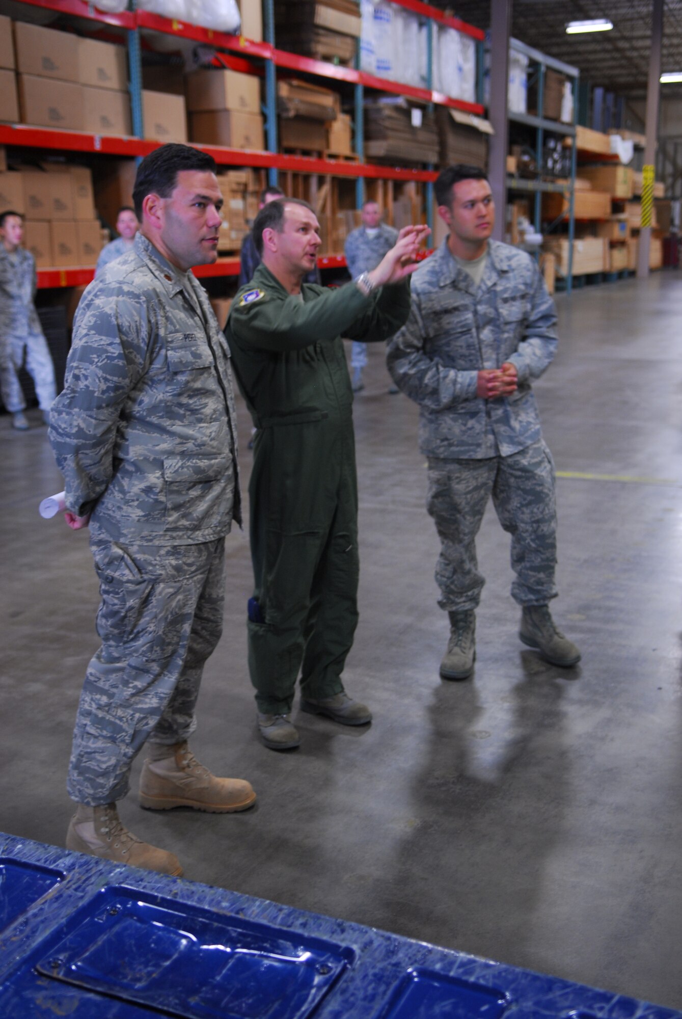 VANDENBERG AIR FORCE BASE, Calif. -- Col. Steven Winters, the 30th Space Wing vice commander, along with Maj. Manuel Perez, the 30th Logistics Readiness Squadron commander, and Tech. Sgt. Forrest Chambers, the 30th LRS surface cargo noncommissioned officer in charge, discuss the changes to be made to the cargo area of Building 5500 here. With the help of the Vandenberg's Air Force Smart Operations for the 21st Century team of experts, the 30th LRS will receive a month-long makeover to increase the overall efficiency of the cargo area. (U.S. Air Force photo/Airman 1st Class Steve Bauer)