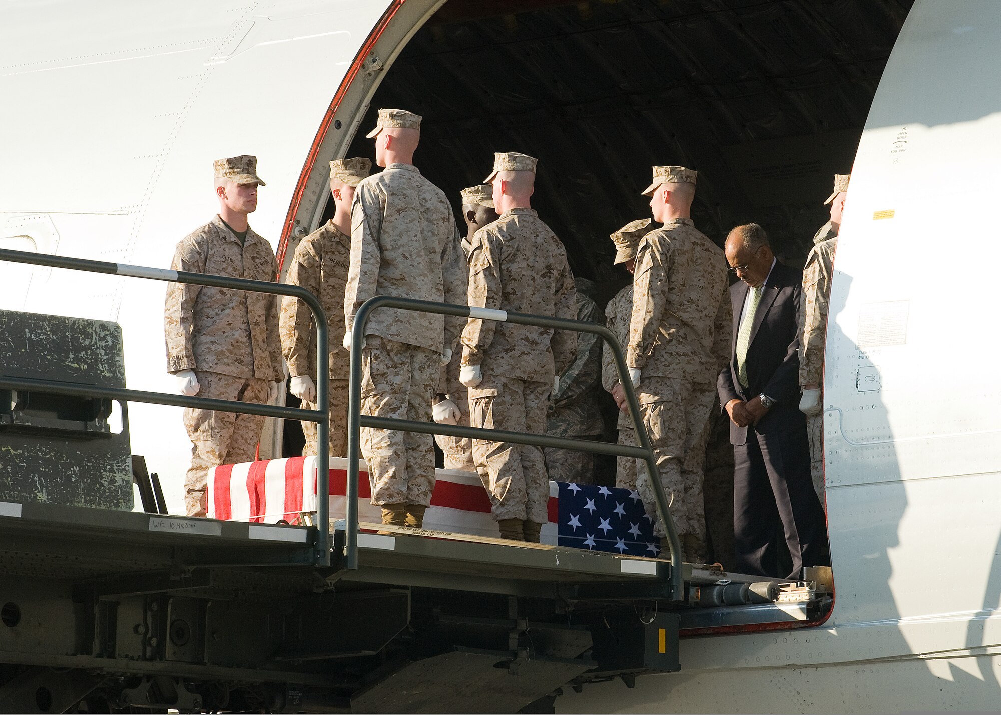 A U.S. Marine Corps carry team and the official party bow their heads April 9, 2009, as the chaplain offers a prayer over the remains of Lance Cpl. Blaise A. Oleski at Dover Air Force Base, Del. Oleski was assigned to the 3rd Battalion, 8th Marine Regiment, 2nd Marine Division, II Marine Expeditionary Force, Camp Lejeune, N.C. (U.S. Air Force photo by Tom Randle)