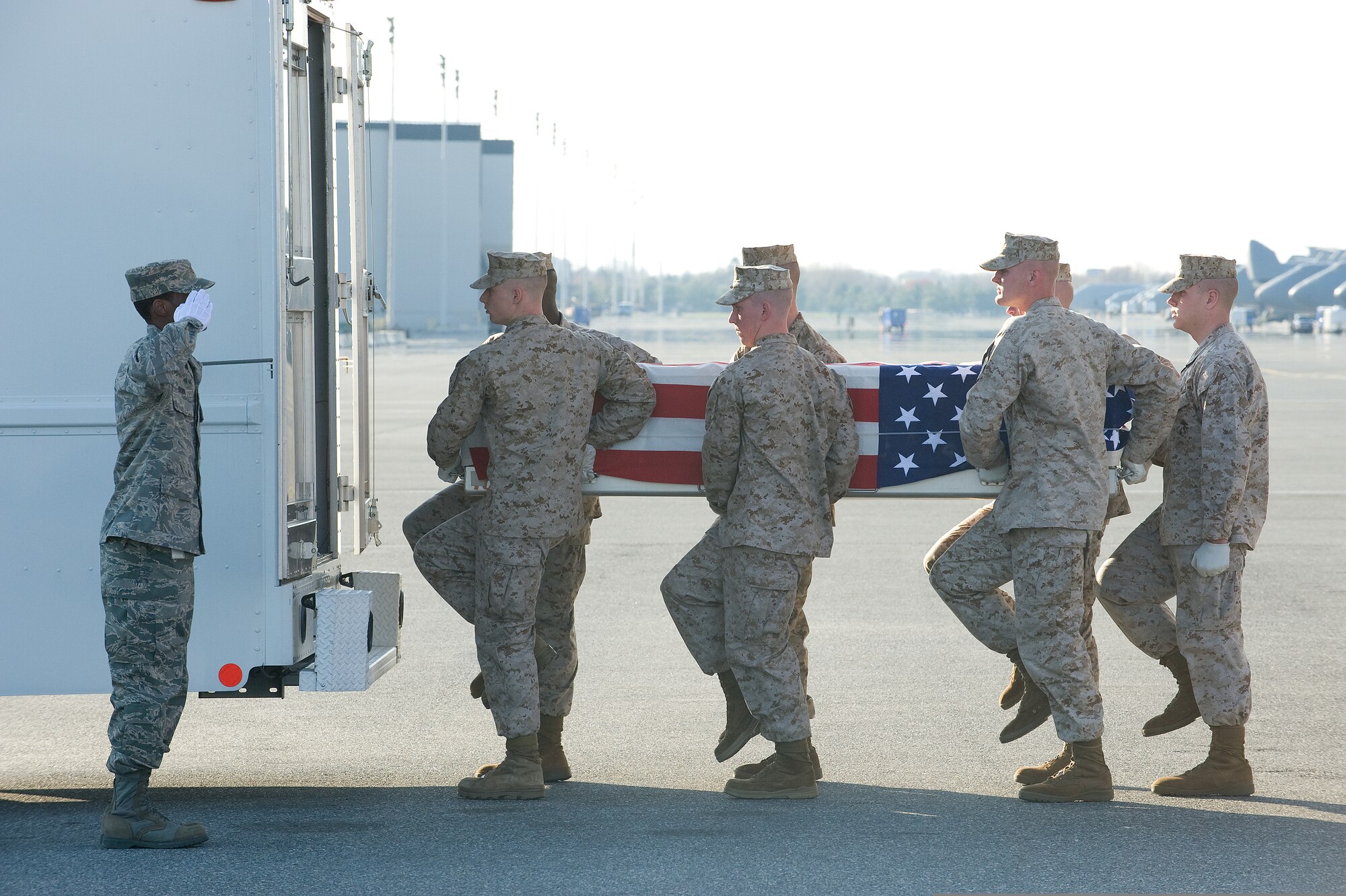 U.S. Marines carry the remains of U.S. Marine Corps Lance Cpl. Blaise A. Oleski during a transfer ceremony on Dover Air Force Base, Del., April 9, 2009. Oleski was assigned to 3rd Battalion, 8th Marine Regiment, 2nd Marine Division, II Marine Expeditionary Force out of Camp Lejeune, N.C. (DoD photo by Tom Randle, U.S. Air Force) 