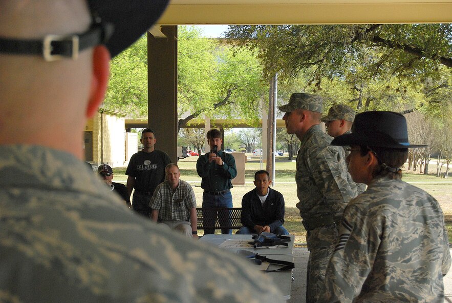 Retired Air Force majors and master sergeants take part in the 2009 Push-Pull at Lackland AFB. This is the first time Push-Pull used retirees, all of whom volunteered to take part. Airman Basic Matthiew Vanwitzenberg and Airman basic Jason Chamber, both from the 321 Training Squadron, flight 383, prepare to demonstrate assembly and disassembly of trainer M-16 rifles. (U.S. Air Force photo/Airman Brian McGloin)
