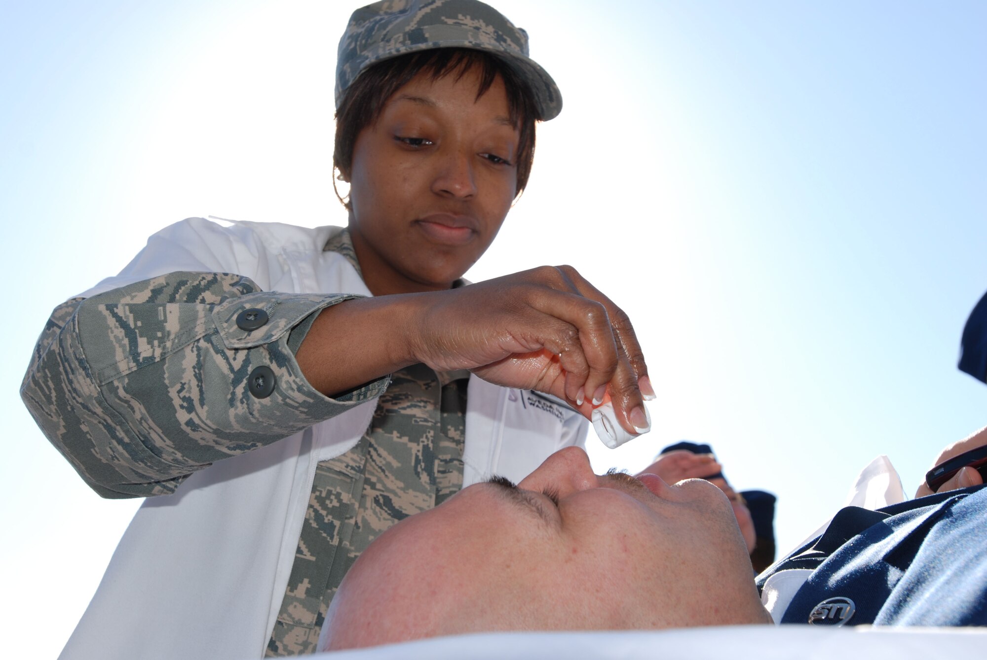 Master Sgt. Wil Serrano, First Sergeant for the 459th Security Forces Squadron, samples aromas for a scalp massage as part of the Human Resource Development Council health fair here on April 5. Tech Sgt. Jamyra Alexander-Jordan, NCOIC of the 459th Operations Group and HRDC representative, owns her own mobile spa business, and volunteered her services including massages, facials, and consultations for the health fair.  

