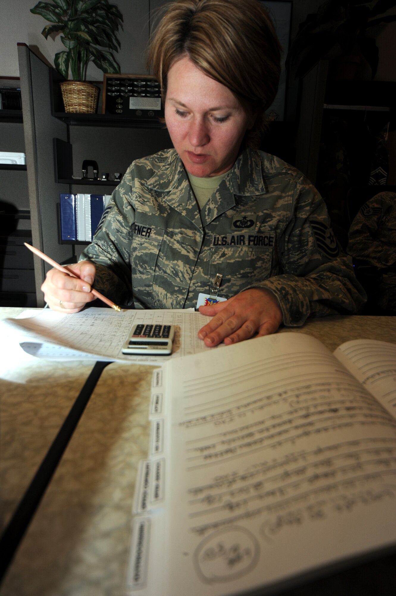 Tech. Sgt. Heather Heffner, an aviation resource management craftsman and a student in the Mobility Operations School's Host Aviation Resource Management Course, works on a class project during a class session April 7, 2009, in the U.S. Air Force Expeditionary Center on Fort Dix, N.J.  Annually, more than 23,000 students graduate from Expeditionary Center courses through on-line courses and in classrooms at Fort Dix and at Hurlburt Field, Fla., and Scott Air Force Base, Ill.  Sergeant Heffner is from the 52nd Operations Support Squadron at Spangdahlem Air Base, Germany.  (U.S. Air Force Photo/Tech. Sgt. Scott T. Sturkol) 