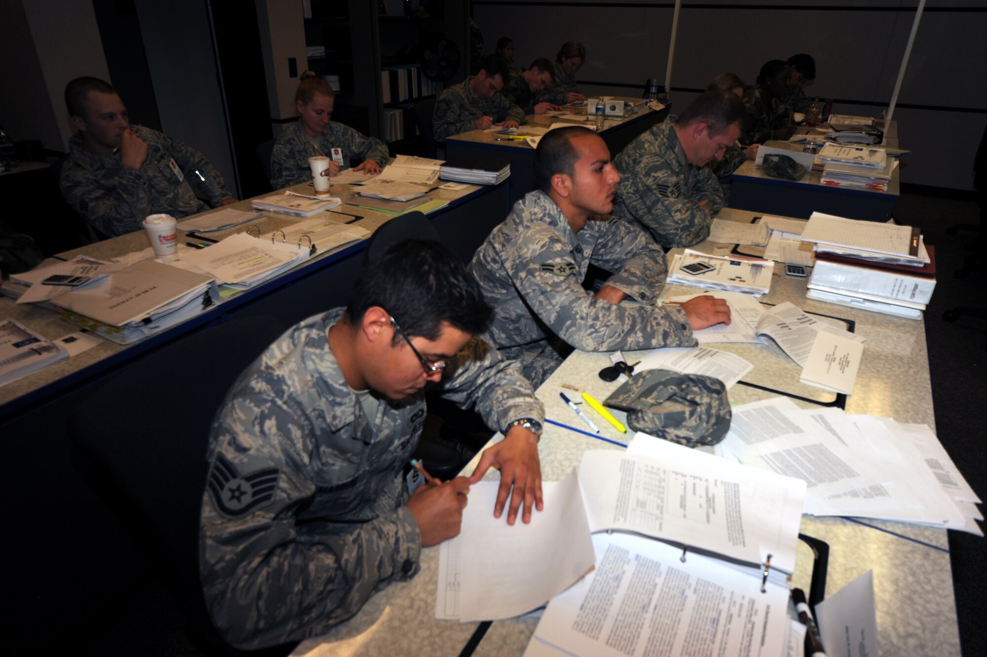 Students in the Mobility Operations School's Host Aviation Resource Management Course work on a class project during a class session April 7, 2009, in the center on Fort Dix, N.J.  Annually, more than 23,000 students graduate from Expeditionary Center courses through on-line courses and in classrooms at Fort Dix and at Hurlburt Field, Fla., and Scott Air Force Base, Ill.  (U.S. Air Force Photo/Tech. Sgt. Scott T. Sturkol) 