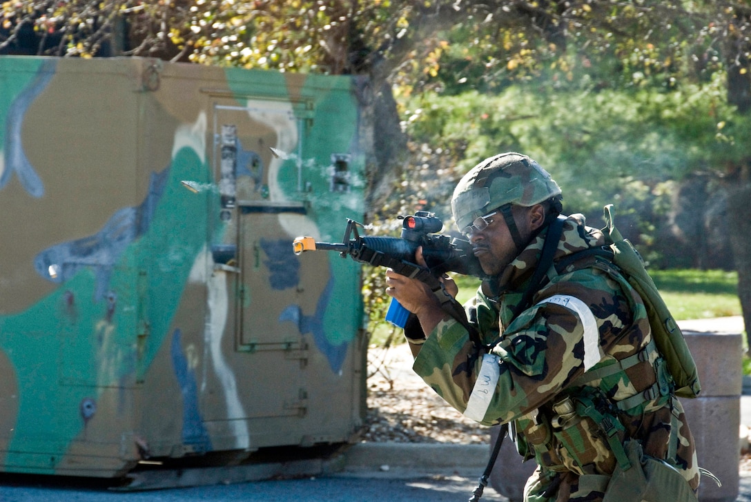 Air Force Senior Airman Eljon Richardson, 113th Security Forces Squadron, D.C. Air National Guard, fires multiple rounds at would-be attackers during the 113th Wing's Operational Readiness Exercise at Andrews Air Force Base, Md., October 12, 2008. The 113 WG is participating in a series of OREs in preparation of a Wing ORI in July 2009. (U.S. Air Force photo by MSgt Jarett Melville) (Released)