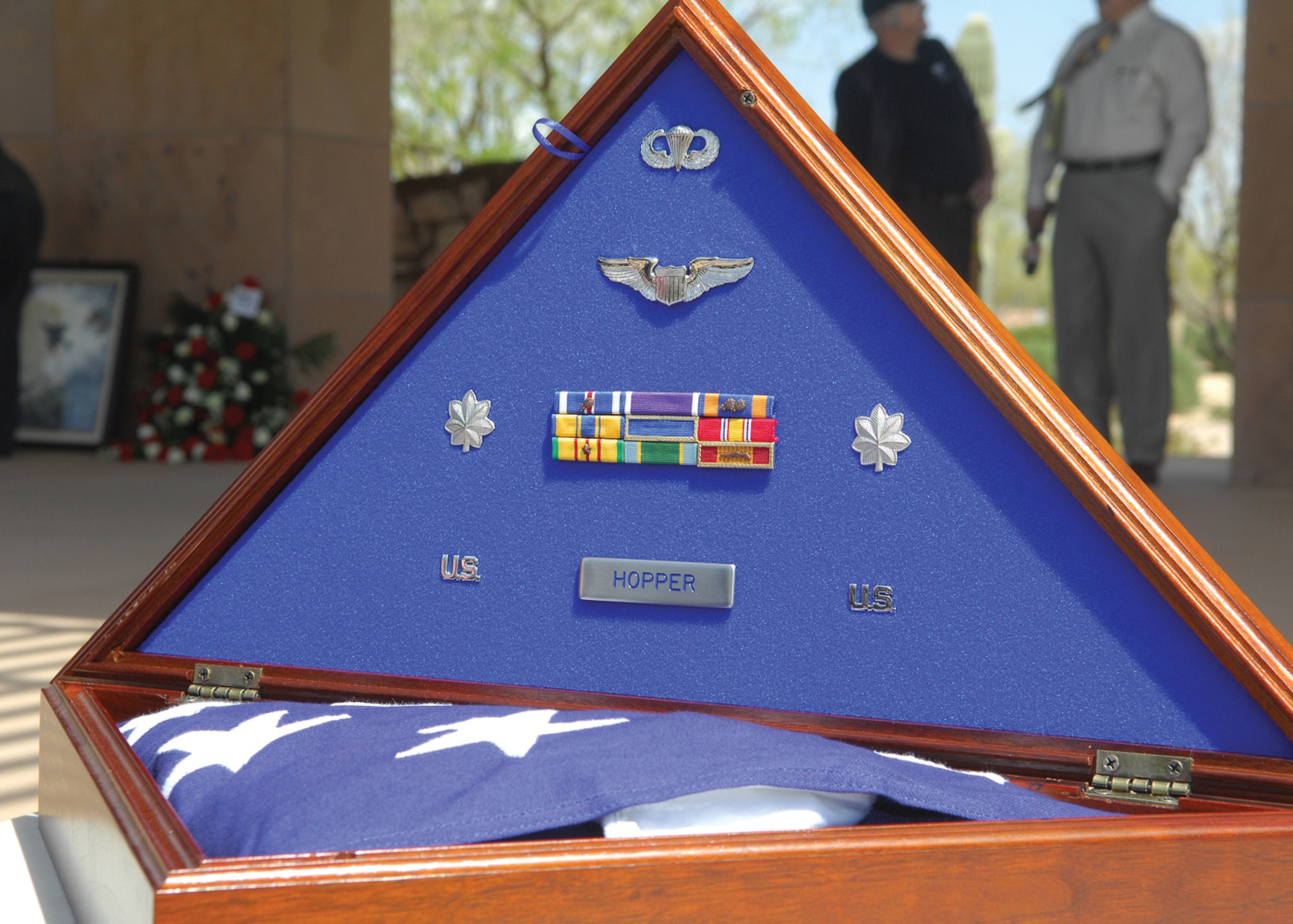 An American flag sits in a heritage flag case and shadow box on display at the funeral service for Lt. Col Earl Hopper.  (U.S. Air Force photo/Photos by Tech. Sgt. Raheem Moore)