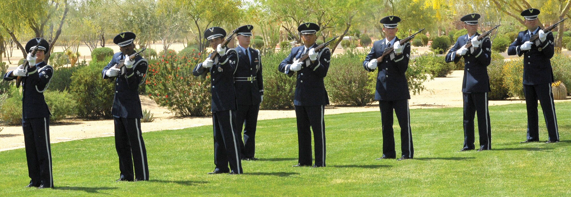 A Luke Air Force Base Honor Guard firing party performs the 21-gun salute at the funeral ceremony for Lt. Col Earl P. Hopper. (U.S. Air Force photo/Photos by Tech. Sgt. Raheem Moore)