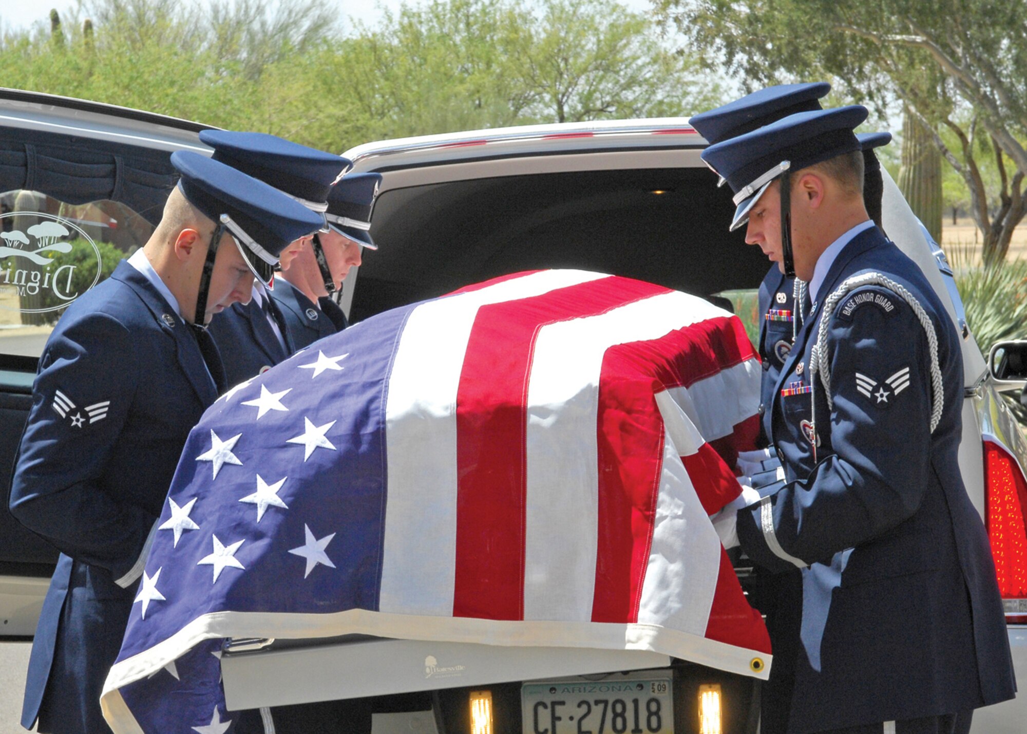 Luke Air Force Base Honor Guard Airmen remove the casket of Lt. Col. Earl Hopper during his funeral ceremony April 3. (U.S. Air Force photo/Photos by Tech. Sgt. Raheem Moore)