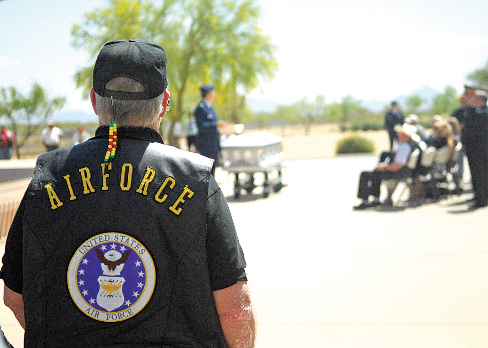 Rev. Dr. George Ray, a Vietnam War veteran, listens intently to the scripture being read by Chaplain (Capt.) Loren Raiford at the funeral ceremony for Lt. Col Earl P. Hopper April 3 at the National Memorial Cemetery of Arizona in Phoenix. Colonel Hopper died in 1968 after being shot down in his F-4 Phantom while patrolling the North Vietnamese-Laotian border during the Vietnam War. His remains were recovered from a mountain in Laos and returned to his family. (U.S. Air Force photo/Photos by Tech. Sgt. Raheem Moore)