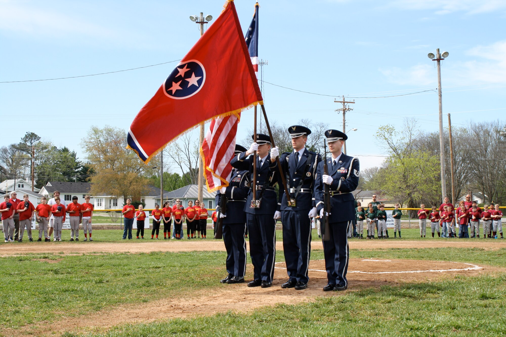 The Arnold Air Force Base Honor Guard presents the colors at the Cowan, Tenn., Little League baseball jamboree April 3.  Pictured are Tech. Sgt. John Bankston, 2nd Lt. Jason Lackey, 2nd Lt. Alex Henning and Tech. Sgt. Jamie Johnson. (Photo by Joel Fortner)