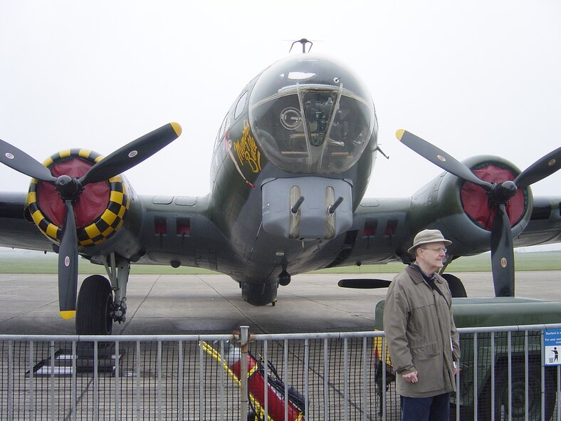 Dr. John Hurt, Chairman of the History Department of the University of Delaware views "Sally B," the only flying B-17G Flying Fortress in the United Kingdom at the Imperial War Museum at Duxford, England.  "Sally B" is the same model aircraft as the one in which Flying Officer Richard M. Mason, the subject of Dr. Hurt’s research, flew as a bombardier during WW II from Polebrook airfield.  (Photo courtesy of Capt. Will Kotheimer, USN)

