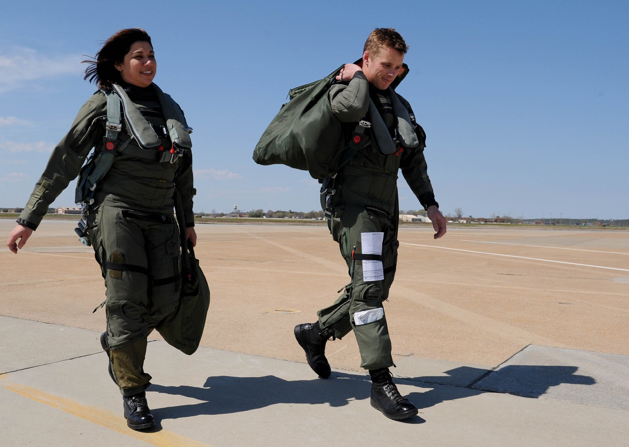 LANGLEY AIR FORCE BASE, Va.-- Bianca Martinez, WTKR Channel 3 broadcaster, and 1st Lt. Glenn Meleen, 71st Fighter Squadron pilot, return to the squadron after completing an orientation flight in an F-15 Eagle April 9. Mrs. Martinez spent the day as a fighter pilot for her series entitled "Do My Military Job," where she explores different career fields in each branch of service. (U.S. Air Force photo/Airman Rebecca Montez)