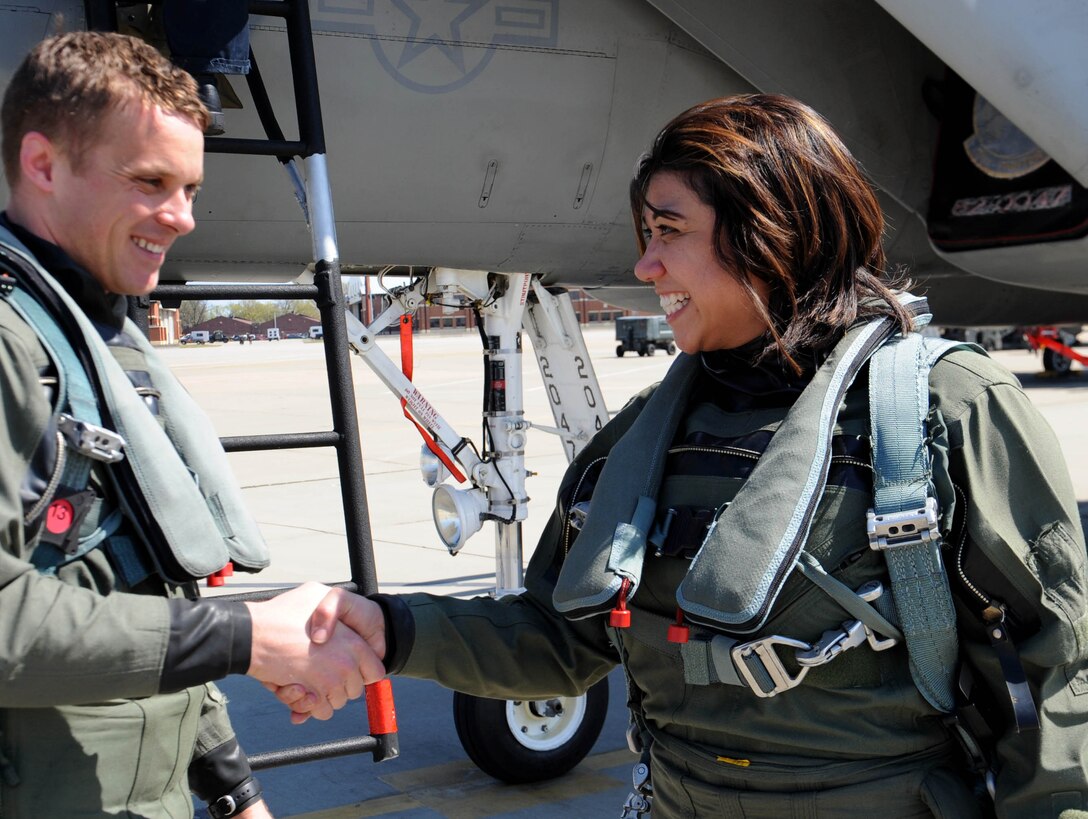 LANGLEY AIR FORCE BASE, Va.-- Bianca Martinez, WTKR Channel 3 broadcaster, thanks 1st Lt. Glenn Meleen, 71st Fighter Squadron pilot, after completing an orientation flight in an F-15 Eagle April 9. Mrs. Martinez spent the day as a fighter pilot for her series entitled "Do My Military Job," where she explores different career fields in each branch of service. (U.S. Air Force photo/Airman Rebecca Montez)