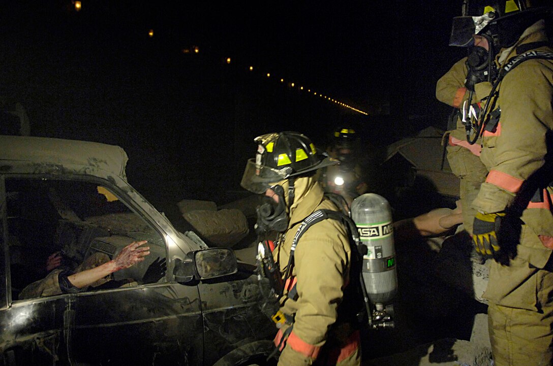 Airman Stonesifer and Senior Airman Scott Dulebohn triage victims during a training scenario in the “rubble room” on April 2. The training is centered on the memorial tunnel, which is an old traffic tunnel that was converted into a facility to train emergency responders. (U.S. Air Force photo/ Senior Airman Renae Kleckner)