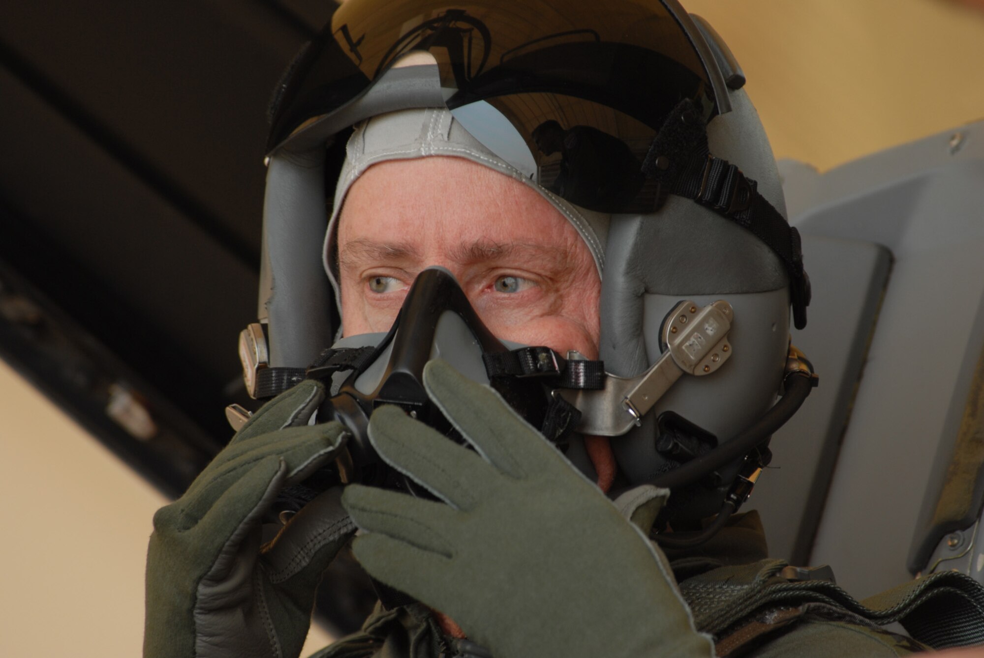 Army Gen. Walter Sharp, United States Forces Korea commander, adjusts his oxygen mask before departing on a familiarization flight at Kunsan Air Base, Republic of Korea, April 10, 2009. General Sharp flew with the Republic of Korea's Air Force's 38th Fighter Group in order to observe their combat capabilities and interoperability with U.S. forces.(USAF Photo By: Senior Airman Angela Ruiz)