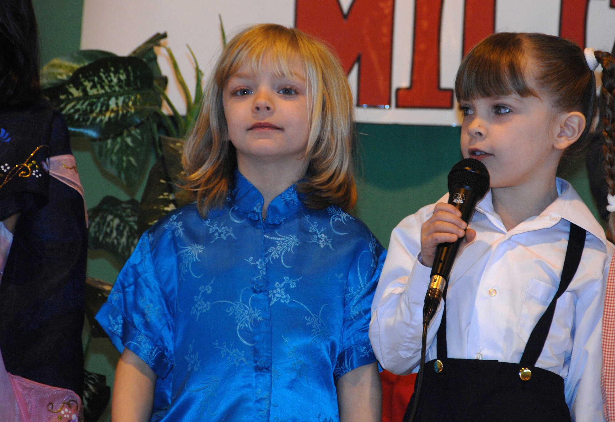 ROYAL AIR FORCE BASE LAKENHEATH--Amelia Campbell a Kindergartner from Lakenheath Elementary School recites her lines during a performance in the gymnasium here April 2, 2009. The performance was an event during the month of the military child. Mrs. De De Brown-Johnson, a first grade teacher, wrote and directed "The Heart of a Military Child" play the children recited. (U.S. Photo by Tech. Sgt. Christopher A. Campbell)