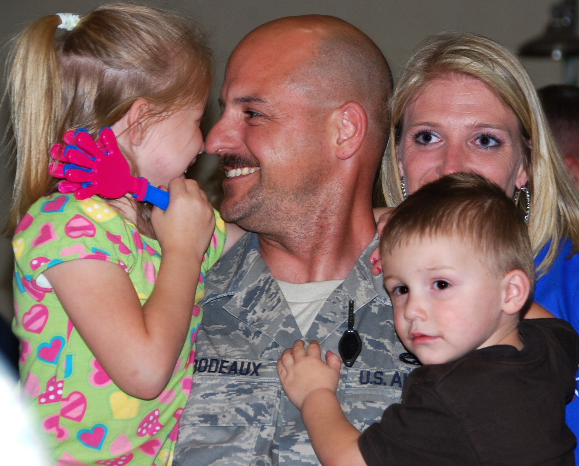 Many family members from the 301st Fighter Wing at Naval Air Station Joint Reserve Base Fort Worth, Texas, enjoy hugs and kisses from those returning from their most recent deployment in support of Operation Iraqi Freedom. More than 40 wing members returned Thursday night with more returning throughout the spring months. (U.S. Air Force Photo/Tech. Sgt. Julie Briden-Garcia)