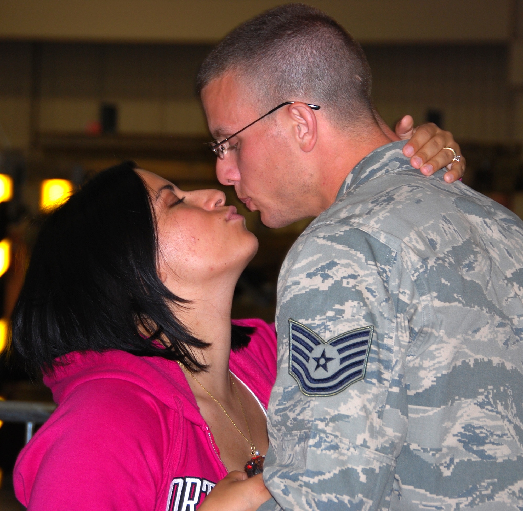 Many family members from the 301st Fighter Wing at Naval Air Station Joint Reserve Base Fort Worth, Texas, enjoy hugs and kisses from those returning from their most recent deployment in support of Operation Iraqi Freedom. More than 40 wing members returned Thursday night with more returning throughout the spring months. (U.S. Air Force Photo/Tech. Sgt. Julie Briden-Garcia)