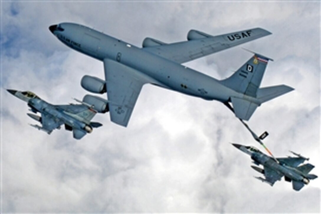 A KC-135 Stratotanker from Royal Air Force Mildenhall, England, refuels a pair of F-16 Fighting Falcons during a multinational exercise over the Baltic States, April 7, 2009. The Stratotankers from feature the "Box D" tail marking dating back to World War II.