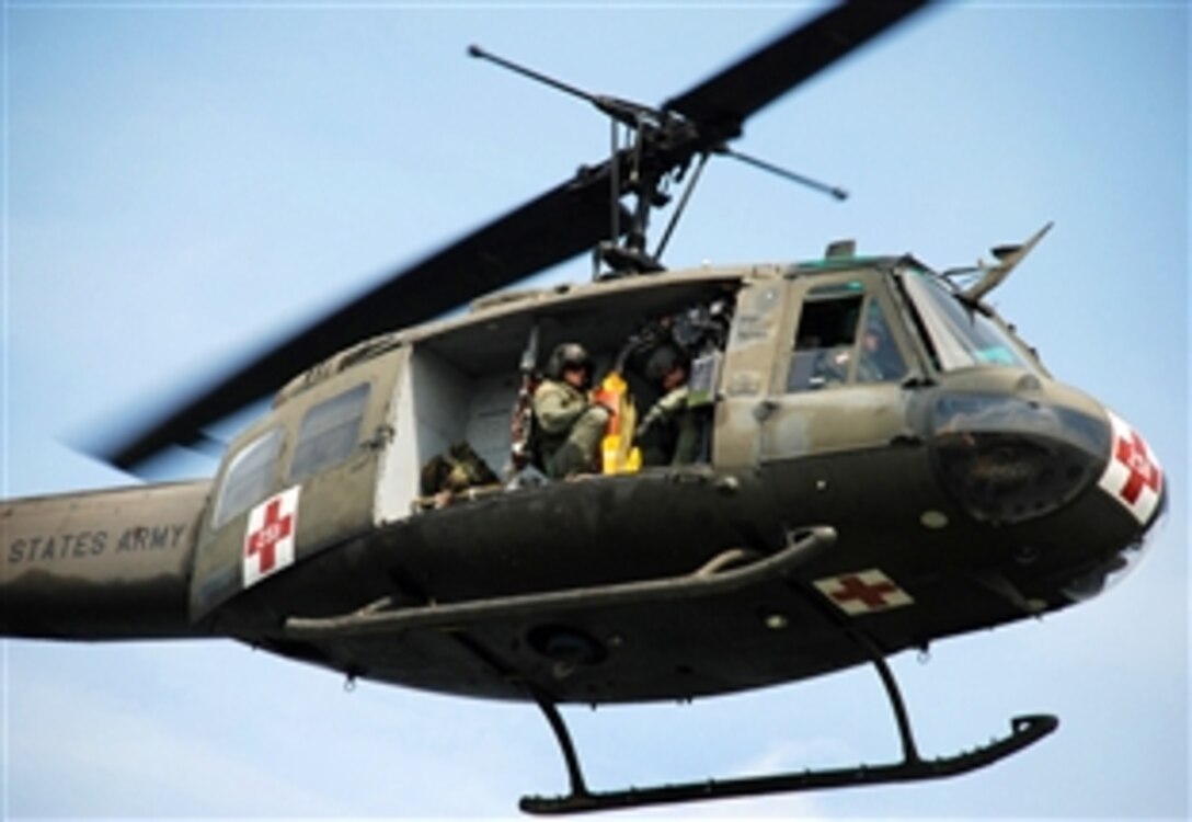 Members of the Louisiana National Guard’s State Aviation Command rescue evacuees during a simulated disaster response exercise at the Lakefront Airport in New Orleans, April 4, 2009. The exercise tests the guard's current response plan, identifies deficiencies and evaluates its ability to respond to multiple missions before the 2009 hurricane season.