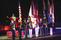 The Military District of Washington Armed Forces Color Guard kicks off the night's celebration of the Month of the Military Child at the Ringling Bros. and Barnum & Bailey Circus on April 9, 2009, at the Patriot Center in Fairfax, Va. Ringmaster Chuck Wagner is in position behind the guard. More than 300 military families received free tickets. DoD photo by Sharon Foster