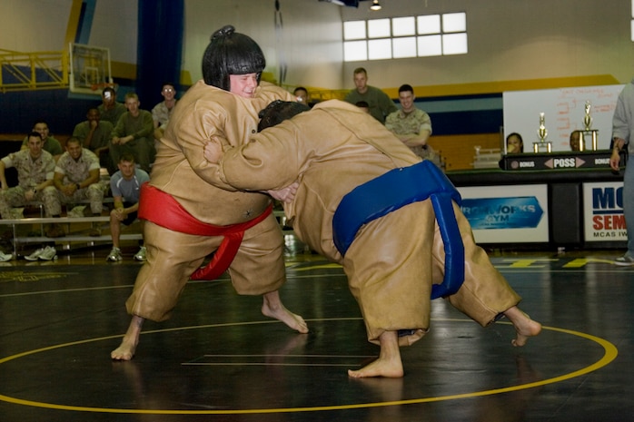 Two Marines struggle against each other as they try to push the other out of bounds to win the fight during the 2009 Commander's Cup Challenge Sumo Basho event at the IronWorks Gym here April 10. The Marine who was able to force his opponent to the ground first or to step out-of-bounds was declared the winner of the match.