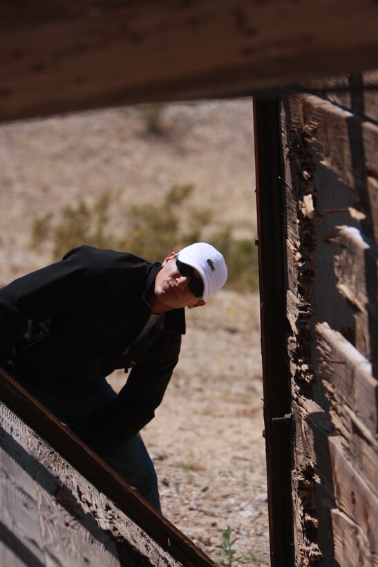 Lance Cpl. Aaron Kristopik, a paralegal clerk with the Combat Center’s Staff Judge Advocate, and a native of New Britain, Conn., looks at run-down structures in the former gold mining community of Old Dale, Calif.