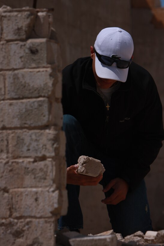 Lance Cpl. Aaron Kristopik, a paralegal clerk with the Combat Center’s Staff Judge Advocate, and a native of New Britain, Conn., looks at rubble from the former mining town, Old Dale, Calif.