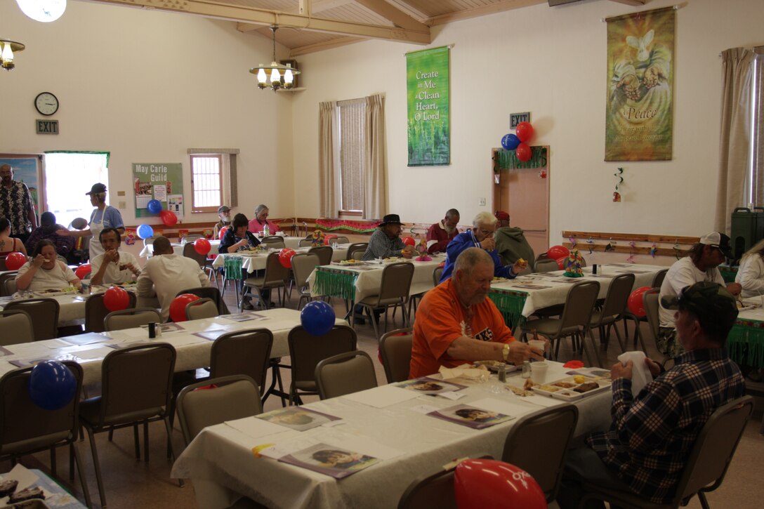 The “early bird” crowd enjoys a meal prepared by Marines and Sodexo employees from the Combat Center’s mess halls April 11 at the Little Church of the Desert.