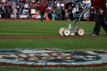 The grounds crew finishes infield before the inaugural game at Citi Field, the new home for the New York Mets, April 13. Marines from various local units unfurled an outfield-sized American flag, and Marines from Marine Fighter Attack Squadron 251 flew F-18 Hornets overhead as part of the opening ceremony. (Official U.S. Marine Corps Photo by Sgt. Randall A. Clinton)