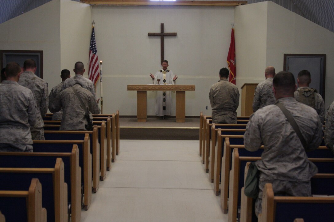 Capt. Conrad Targonski, the Combat Center’s religious ministries director, holds an Easter Mass at the Camp Wilson chapel April 12.